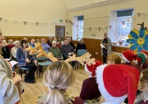 Cosy Spaces Colmonell 7th December 2022 and School kids singing carols